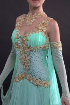 The closeup of the Mint and Gold Standard Gown with a Pleated Georgette Skirt
